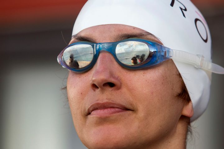 Ultra-marathoner Norma Bastidas looks to the horizon just before starting a record-setting triathlon as part of a campaign against human trafficking, in Cancun March 1, 2014.