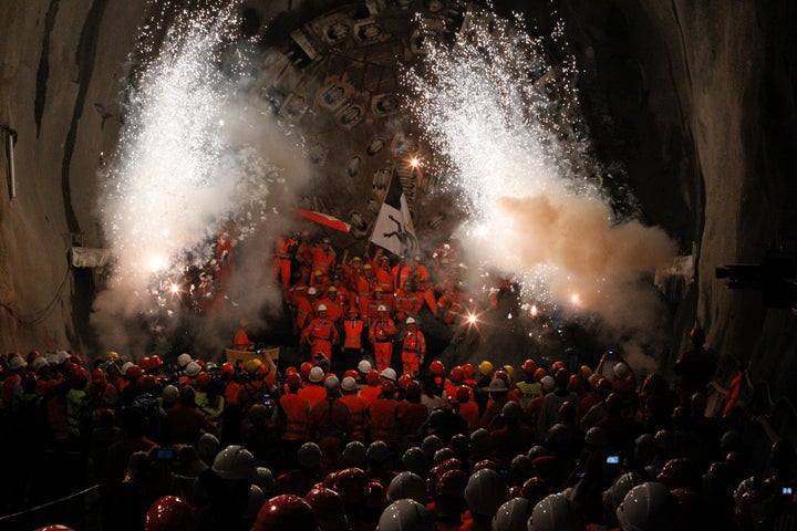 <strong>Miners celebrate breaking through the final section of the tunnel</strong>