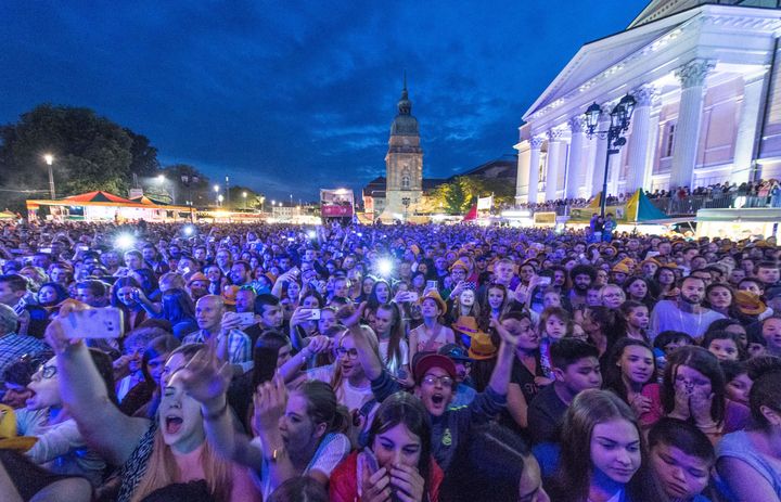 German police arrested three men after dozens of women made complaints of sexual assaults at the Schlossgrabenfest music festival.