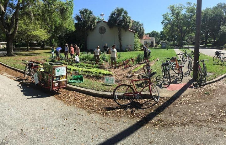 Volunteers arrive at a farmlette on bicycle. According to Bumbier, only "pedal-power" is used by Fleet Farming to "maintain, harvest and sell local organic produce to the community."