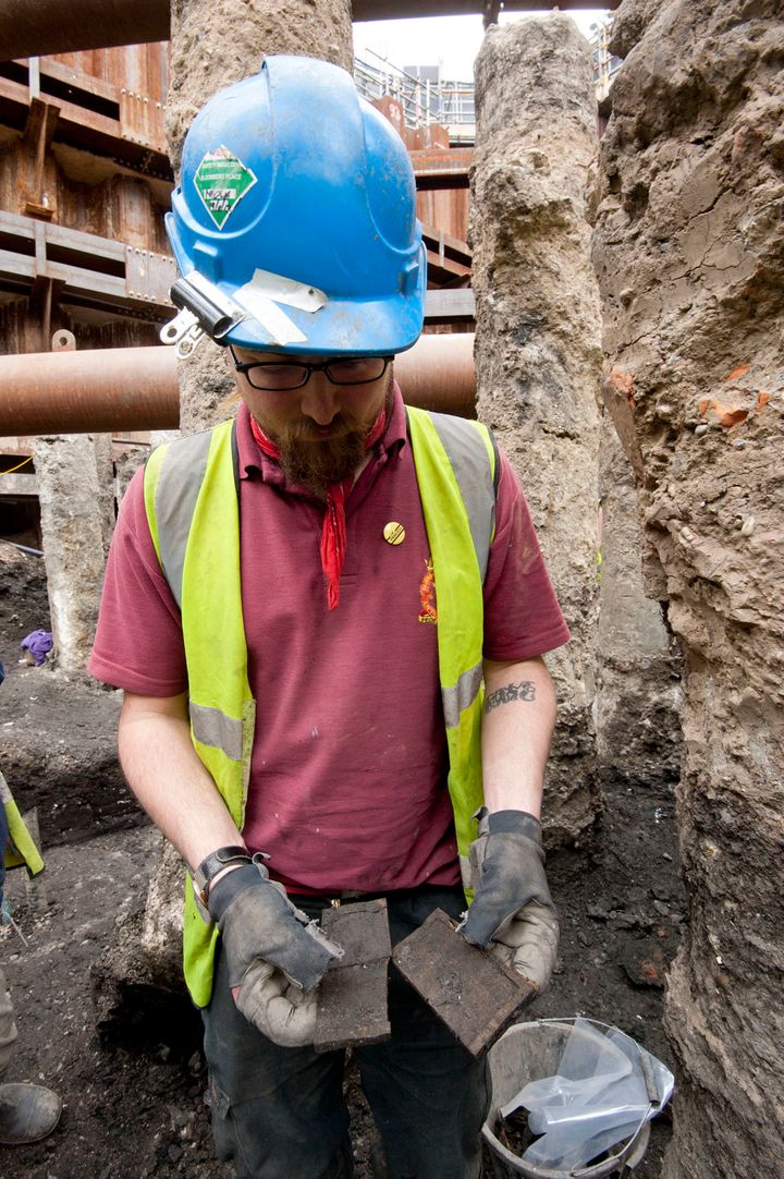 An archaeologist with a recently-discovered tablet