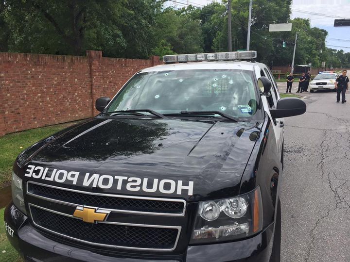 Bullet holes in the windshield of a Houston Police Department patrol car on May 29, 2016. The shooting left two people dead, including the gunman, and another six wounded.