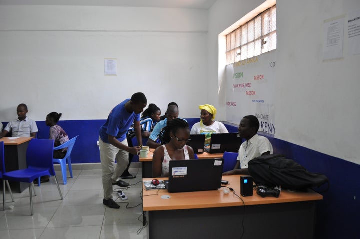 Young "citizen cartographers" are trained in Nairobi's Mathare slum by a member of Spatial Collective.