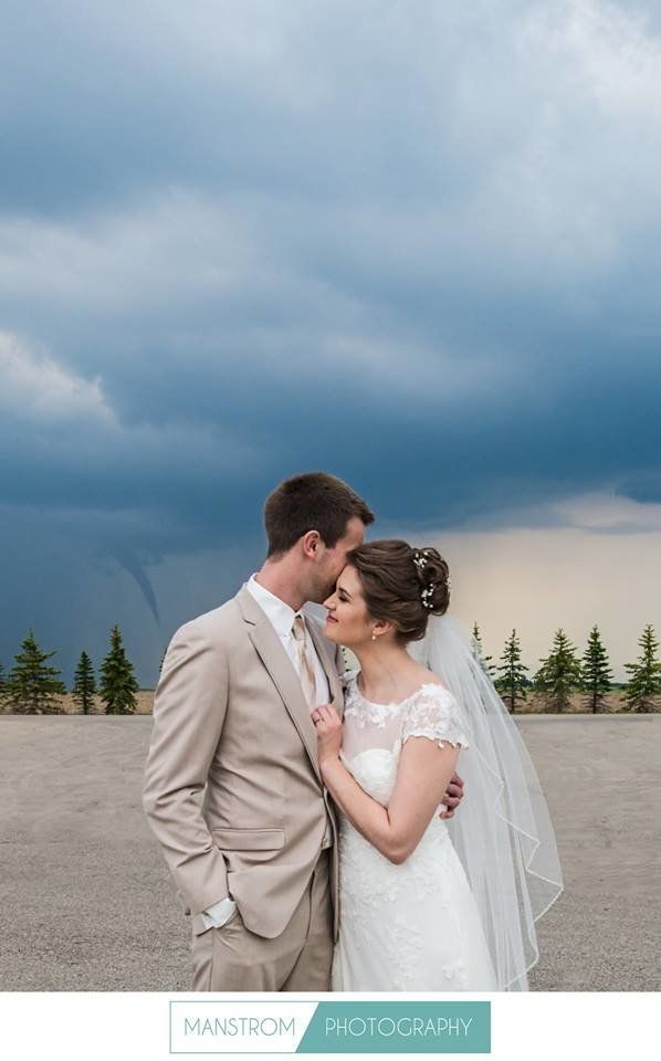 A funnel cloud photobombed a bride and groom before their ceremony near Moorhead, Minnesota. 