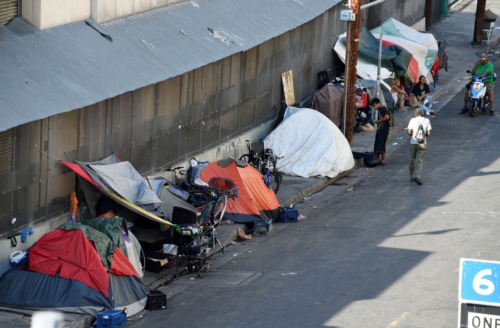 Tents are placed along Skid Row is seen in Los Angles on September 23, 2015. Los Angeles elected officials this week declared a homelessness 'state of emergency' and pledged $100 million in funding to tackle the crisis. AFP PHOTO / ROBYN BECK (Photo credit should read ROBYN BECK/AFP/Getty Images)