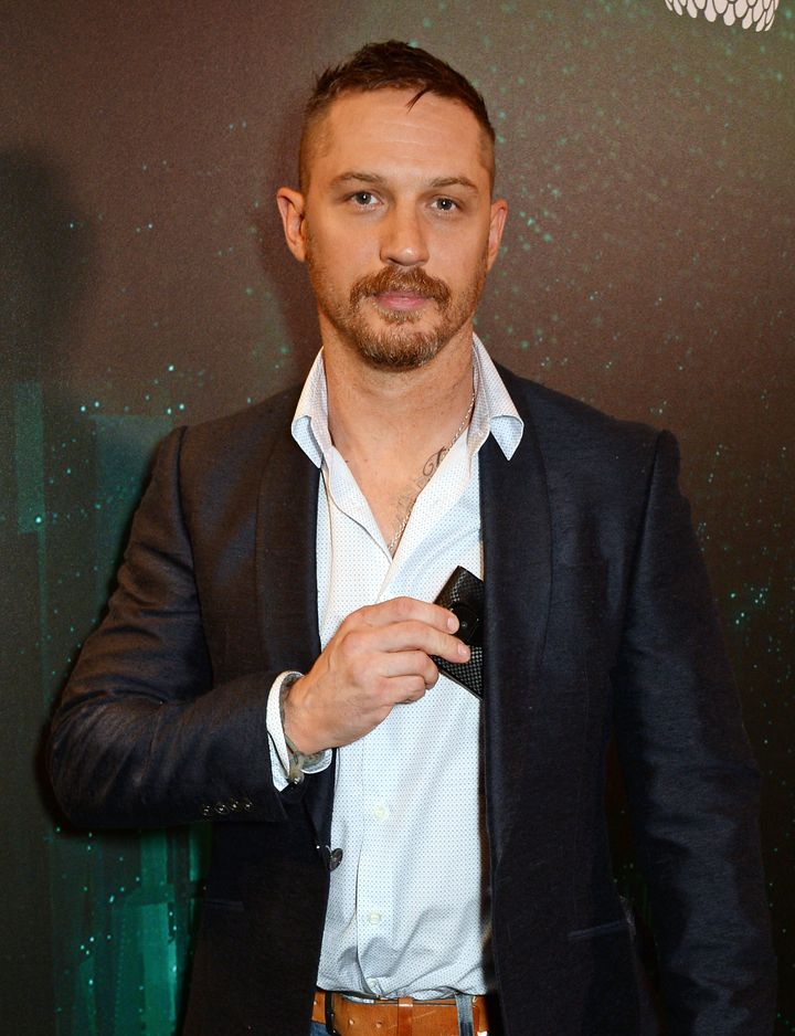Tom Hardy with a phone he's probably already ditched.