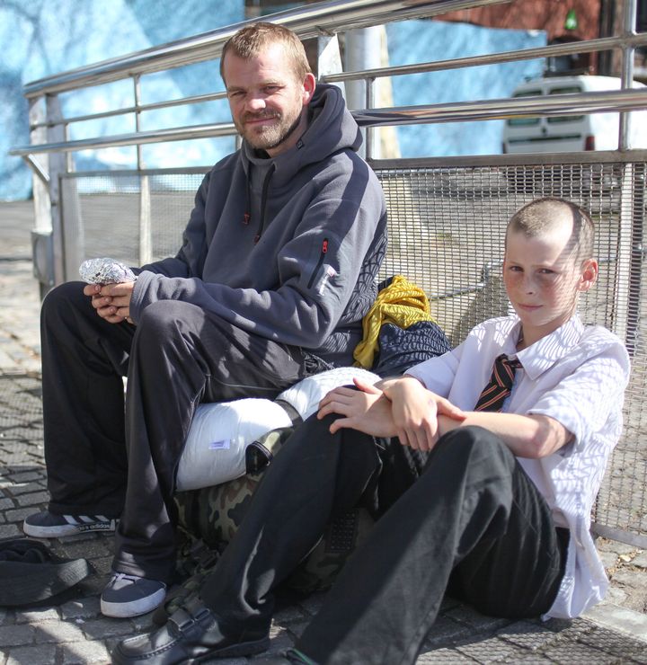 Wain Howell, who is homeless, sits with Hamish Anderson