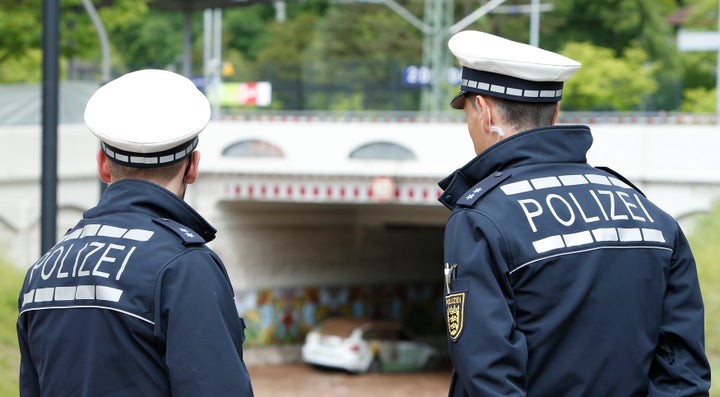 German police officers at the local train station after floods near Stuttgart, Germany, May 30, 2016. Authorities arrested three men in the country on suspicion of planning a terror attack.