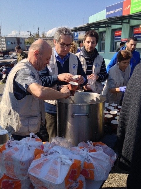 Maurice Joyeux, second from left, and Cecile Deleplanque, far right, are seen serving food at Port of Piraeus, Greece.