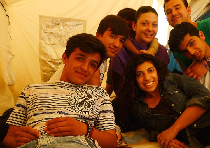 Hadas Yanay, right side of frame in green jacket, smiles for the camera.