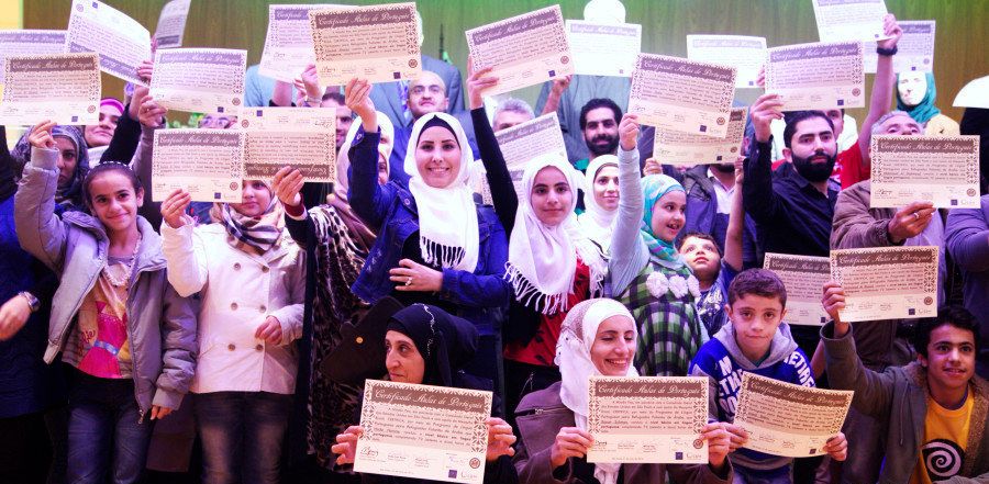 Eight Syrian refugees have just completed a Portuguese language class, and they're really excited about it.