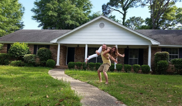 Zac and Shannon Carter, who have been married for two years, pose in front of their newly purchased home in Pensacola, Florida.