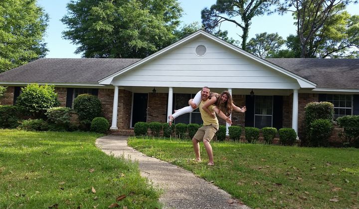 Zac and Shannon Carter, who have been married for two years, pose in front of their newly purchased home in Pensacola, Florida.