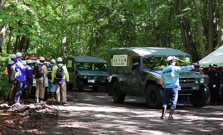 Japanese military vehicles assist in the search for 7-year-old Yamato Tanooka.