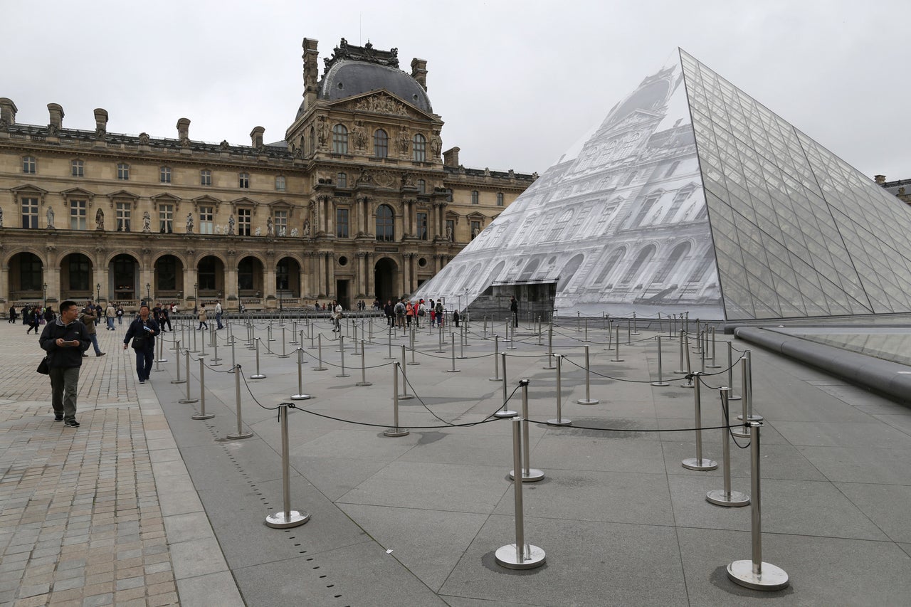 The Louvre looked eerily quiet as tourists were turned away