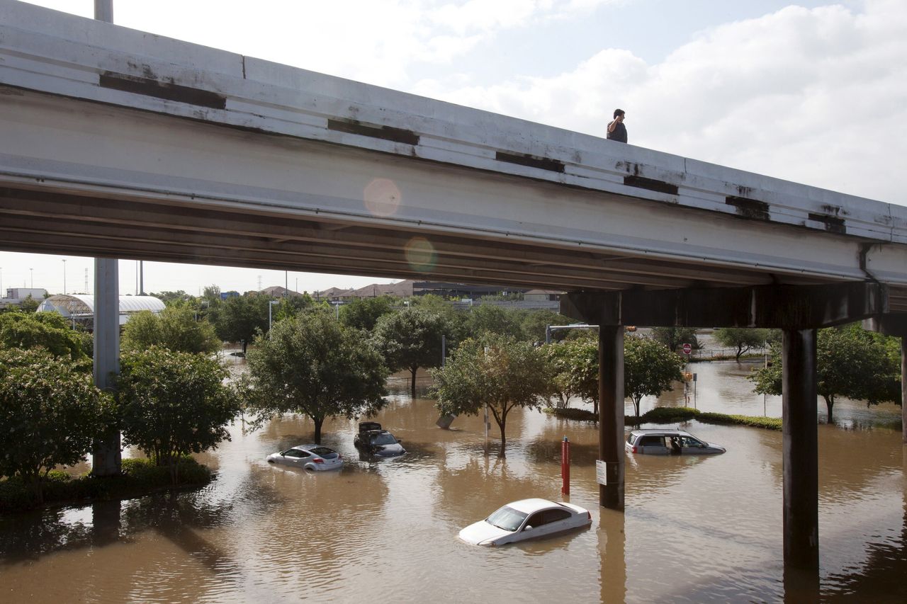 Motorists survey the floodwaters in southwest Houston on May 26, 2015.
