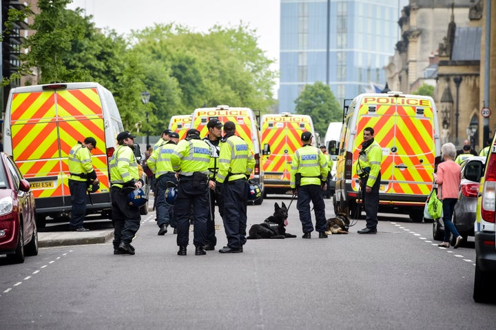 A heavy police presence as a small group of people attend a far right anti-refugee demonstration at College Green in Bristol.