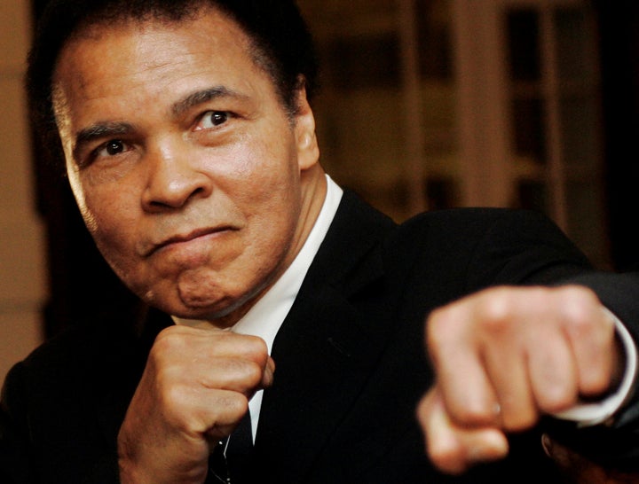 Muhammad Ali poses during the Crystal Award ceremony at the World Economic Forum on January 28, 2006.