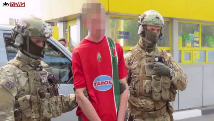 Ukrainian police with Gregoire Moutaux who they claim was planning 15 attacks on Euro 2016