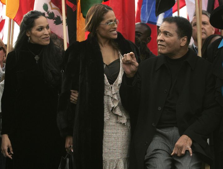 Muhammad Ali with his daughters, Jamillah, left, and Rasheeda, at the dedication of the Muhammad Ali Center in Louisville, Kentucky on November 20, 2005.