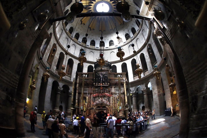 <strong>Christian pilgrims gather around the 'Edicule of the Tomb of Jesus Christ' in The Church of the Holy Sepulchre</strong>