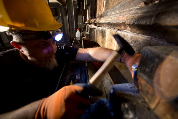 <strong>A Greek worker at the tomb</strong>