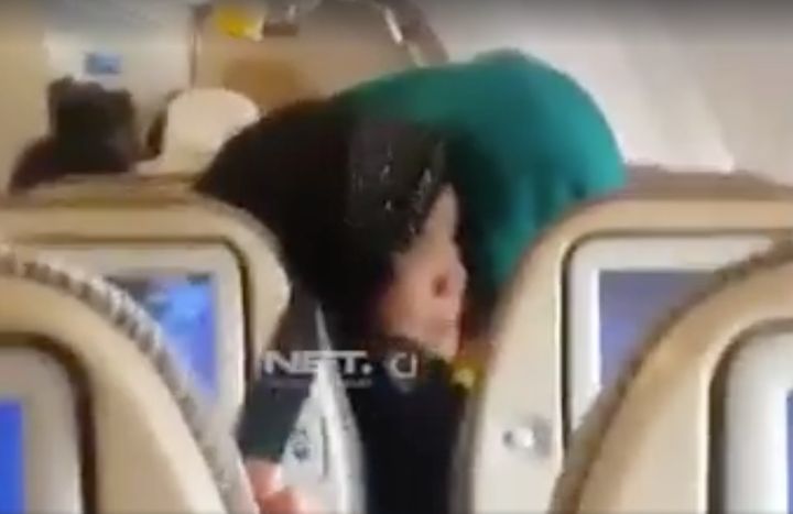 The footage shows the plane jolting while passengers cry out in fear 