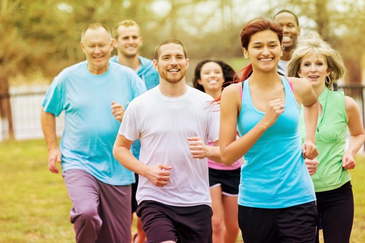 Diverse adults exercising with running club group Steve Debenport via Getty Images