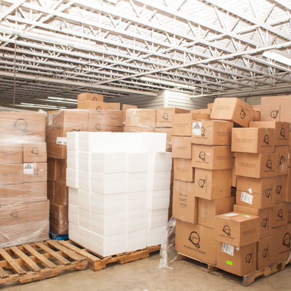 A stack of coolers and boxes at Jeni's warehouse.