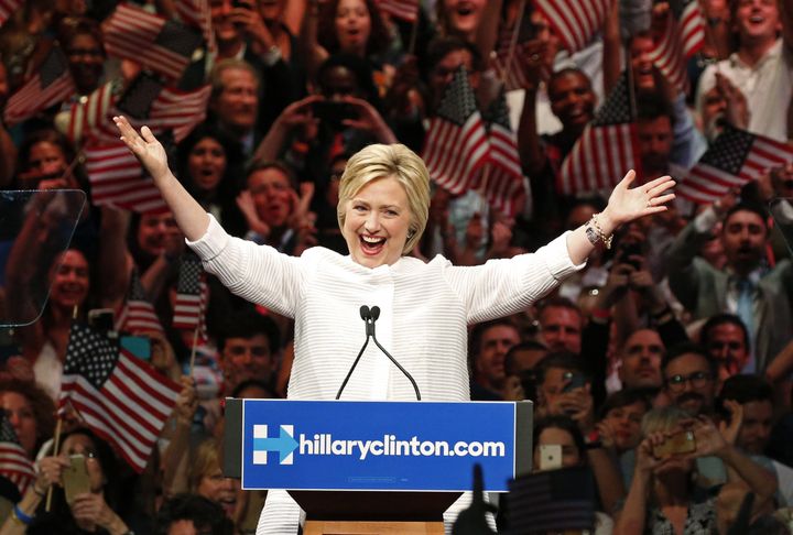 Hillary Clinton celebrates Tuesday night as she crosses a key delegate threshold.