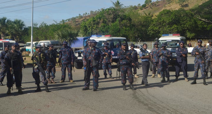 Heavily-armed Papua New Guinea police form a roadblock, preventing students from leaving the University of Papua New Guinea in Port Moresby.