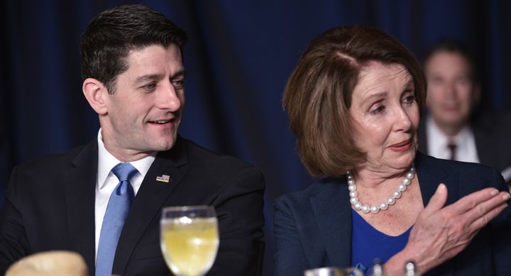 House Speaker Paul Ryan chats with House Minority Leader Nancy Pelosi during the National Prayer Breakfast on February 4, 2016, in Washington, D.C. 