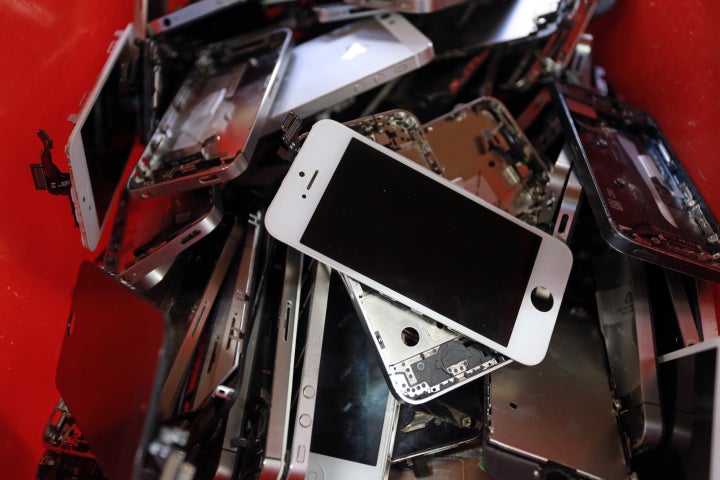 A picture taken Nov. 7, 2014, in Brive, southern France, shows smartphone screens in the Love2recycle.fr recycling company. The company collects and repairs all kind of smartphones before bringing them to the market.