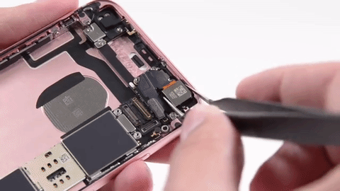 Removing the back camera from the iPhone 6S. Watch the full "teardown" video.