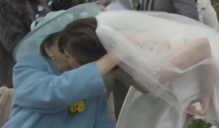 June hugs her granddaughter Sarah on her wedding day.