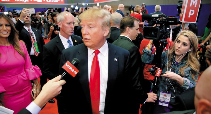 Trump being interveiwed amid a swarm of media after a March 10 GOP debate in Miami