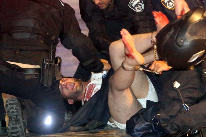 Israeli police arrest a suspect shortly after the attacks on Wednesday night 