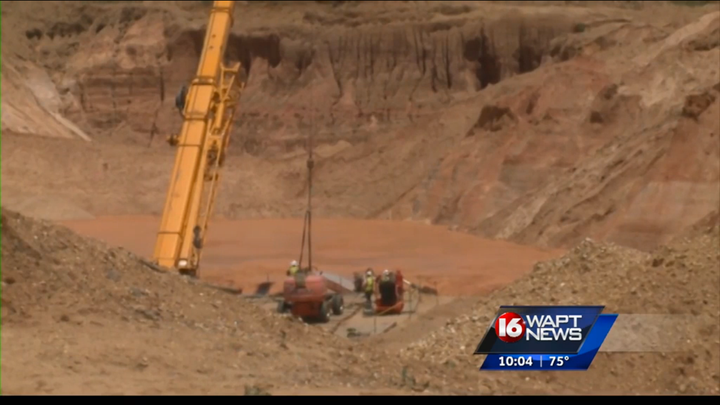 Authorities have been working around the clock to recover the bodies of two men who were buried in a Mississippi gravel pit.