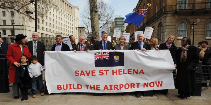 A group of MPs with demonstrators from the island of St Helena campaign in Westminster