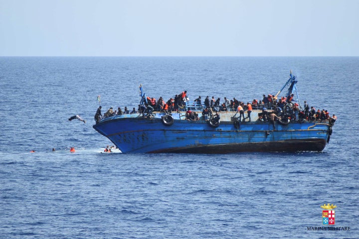 The European Union this week outlined its latest plans to stem migration from the Middle East and Africa. Above, a boat packed with migrations capsizes off the coast of Libya last month.