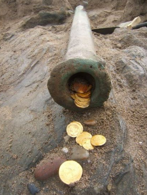 Gold coins and a cannon