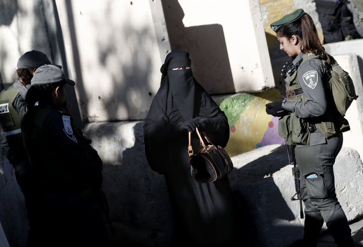 The Israeli military revoked permits for 83,000 Palestinians to visit Israel and said it would send hundreds more troops to t