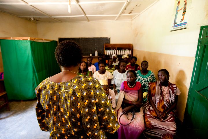 A nurse at the Saint Bakhita Health Centre in Yei discusses family planning and HIV counseling and testing with clients before their routine antenatal visits. IntraHealth has worked with the health center since 2007 to train and support Sister Veronika's staff of health workers.
