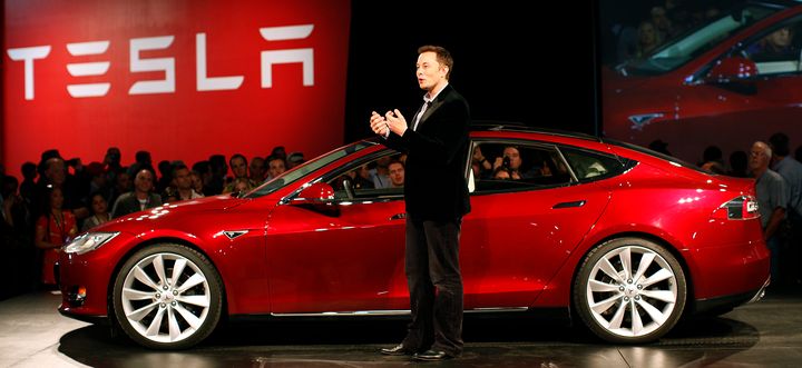 Tesla Motors CEO Elon Musk speaks next to the Model S during an event at the Tesla factory in Fremont, California, on Oct. 1, 2011.