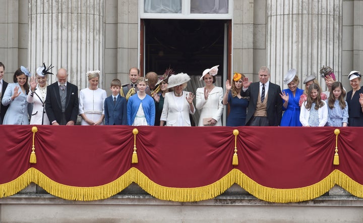 Members of the royal family wait on the balcony of Buckingham Palace for Queen Elizabeth to return after the Trooping the Colour ceremony.