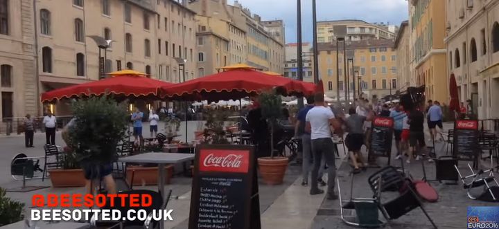 <strong>England fans said to be enjoying a 'civilised' drink came under attack from French hooligans </strong>