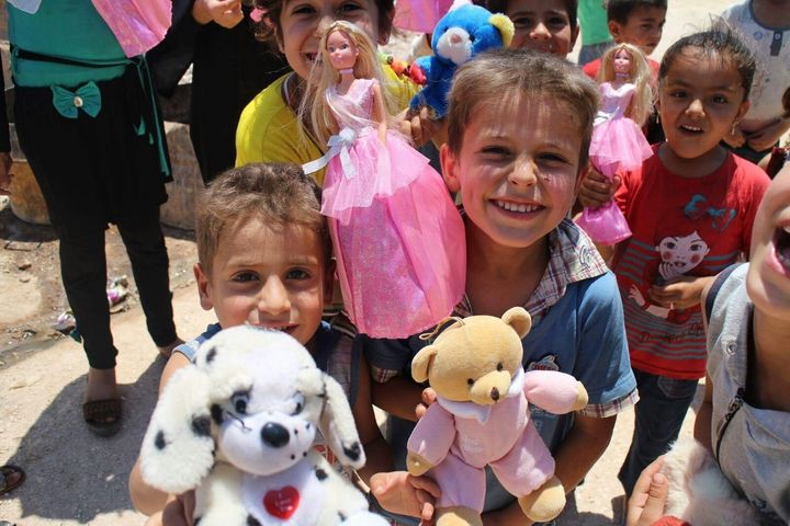 Adham's charity organization delivers toys to children in Aleppo several times per year.