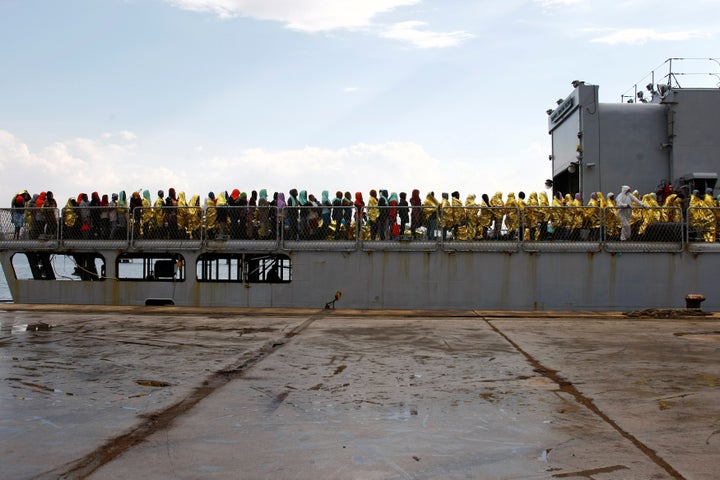 Migrants disembark from the Italian Navy vessel Aviere in the Sicilian harbour of Augusta, Italy, June 10, 2016.