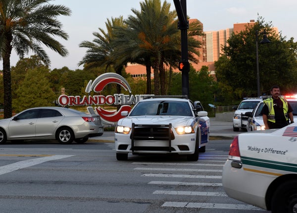 Police lock down Orange Avenue around Pulse nightclub, where people were killed by a gunman in a shooting rampage in Orlando,