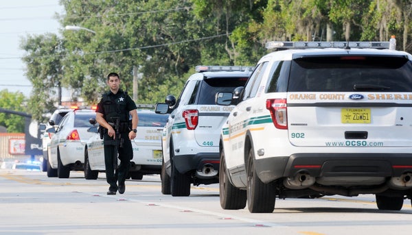 Orlando police officers seen outside of Pulse nightclub after a fatal shooting and hostage situation on June 12, 2016 in Orla
